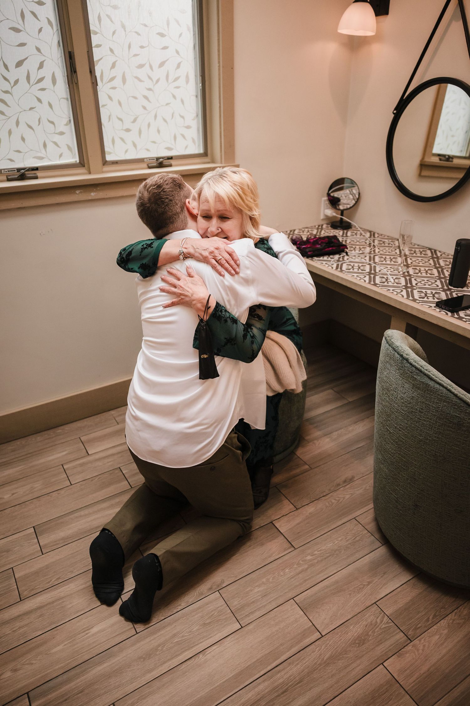 Groom hugging grandmother during emotional getting ready moment at Briar Barn Inn wedding Massachusetts