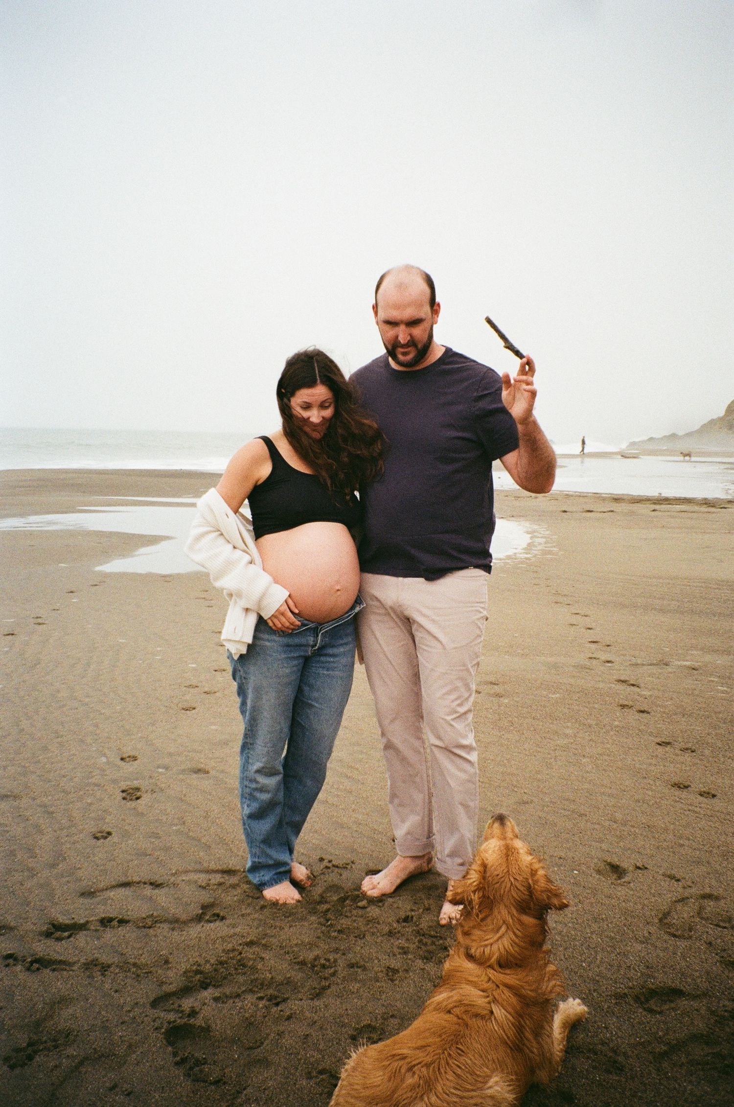 documentary maternity photographer capturing everyday moments with a timeless, cinematic feel on 35mm film in Baker Beach