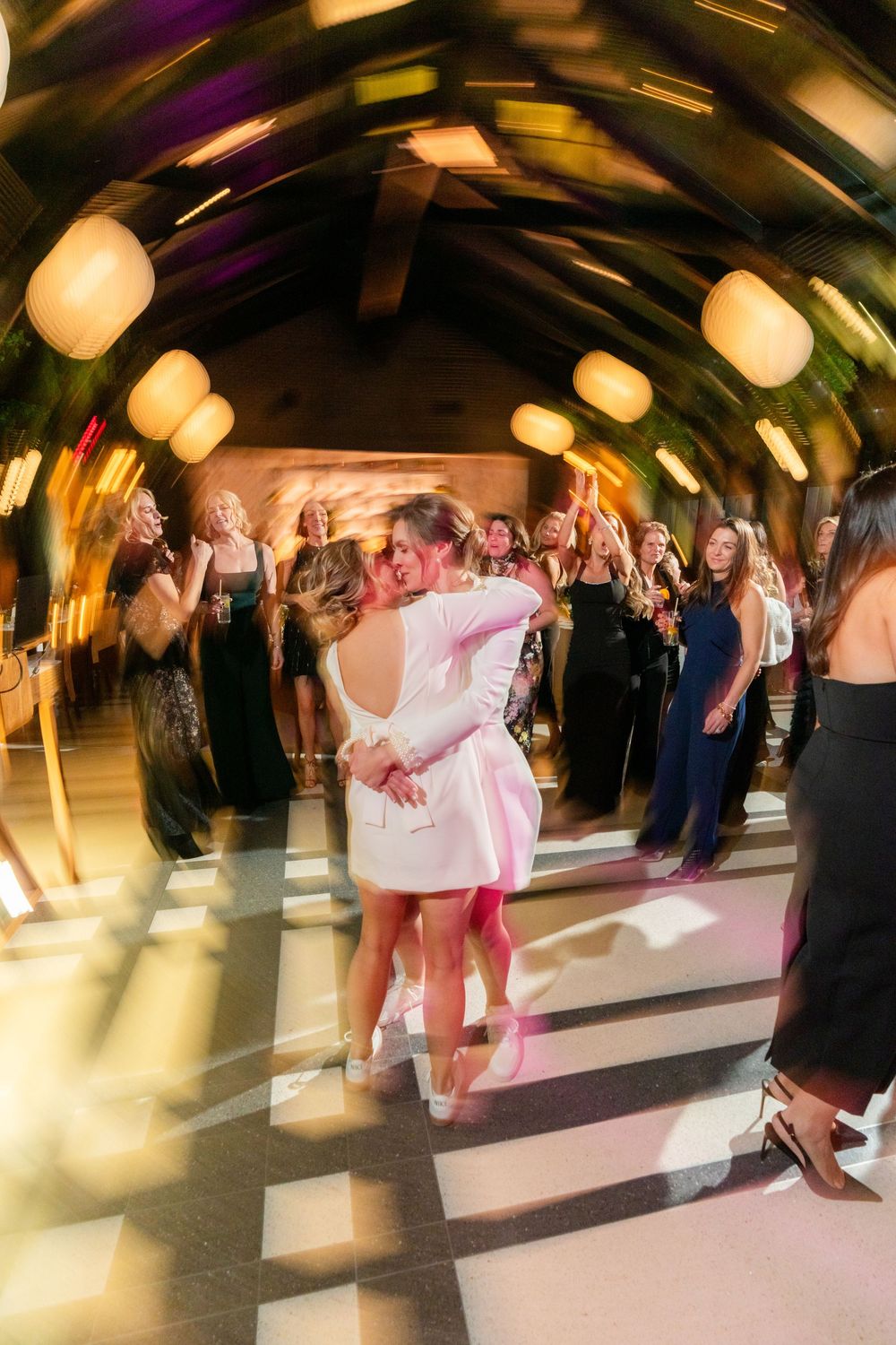 Wild dance floor moments with the brides at a February Shinola Hotel Wedding