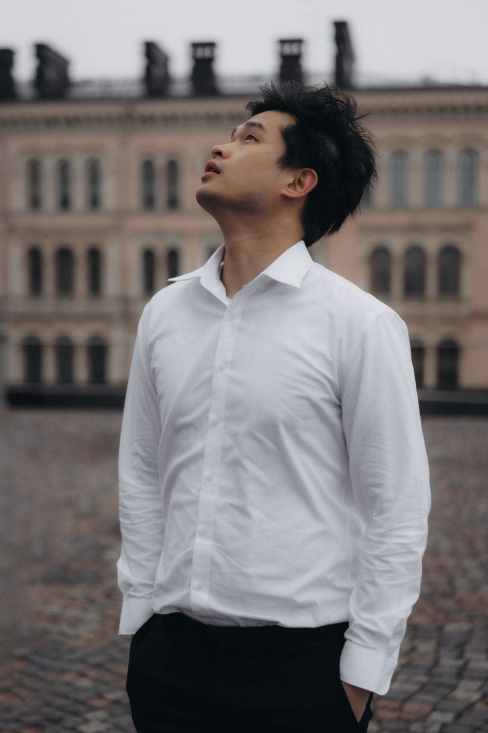 Editorial portrait of a groom-to-be during an engagement session at Senate Square in Helsinki