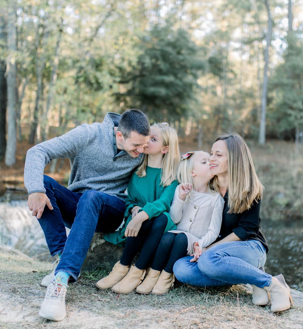 Family sitting in the park at Sesquicentennial State Park in Columbia, SC with local family photographer