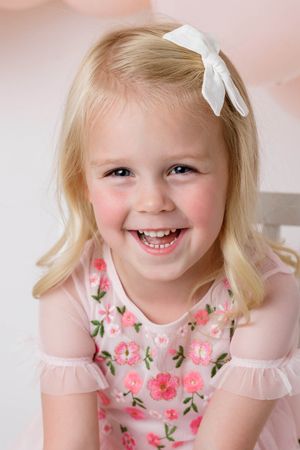 Temecula child photographer: Smiling little girl's portrait photography.