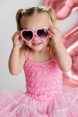 Murrieta child photographer: Cute little girl in pink tutu dress for 2nd birthday photoshoot.