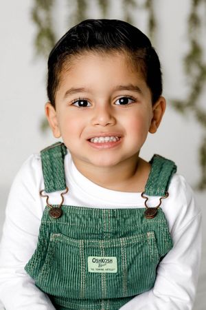 Smiling toddler boy's portrait by Murrieta kids photographer.