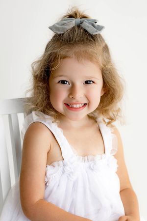 Portrait of little girl for third birthday photoshoot.