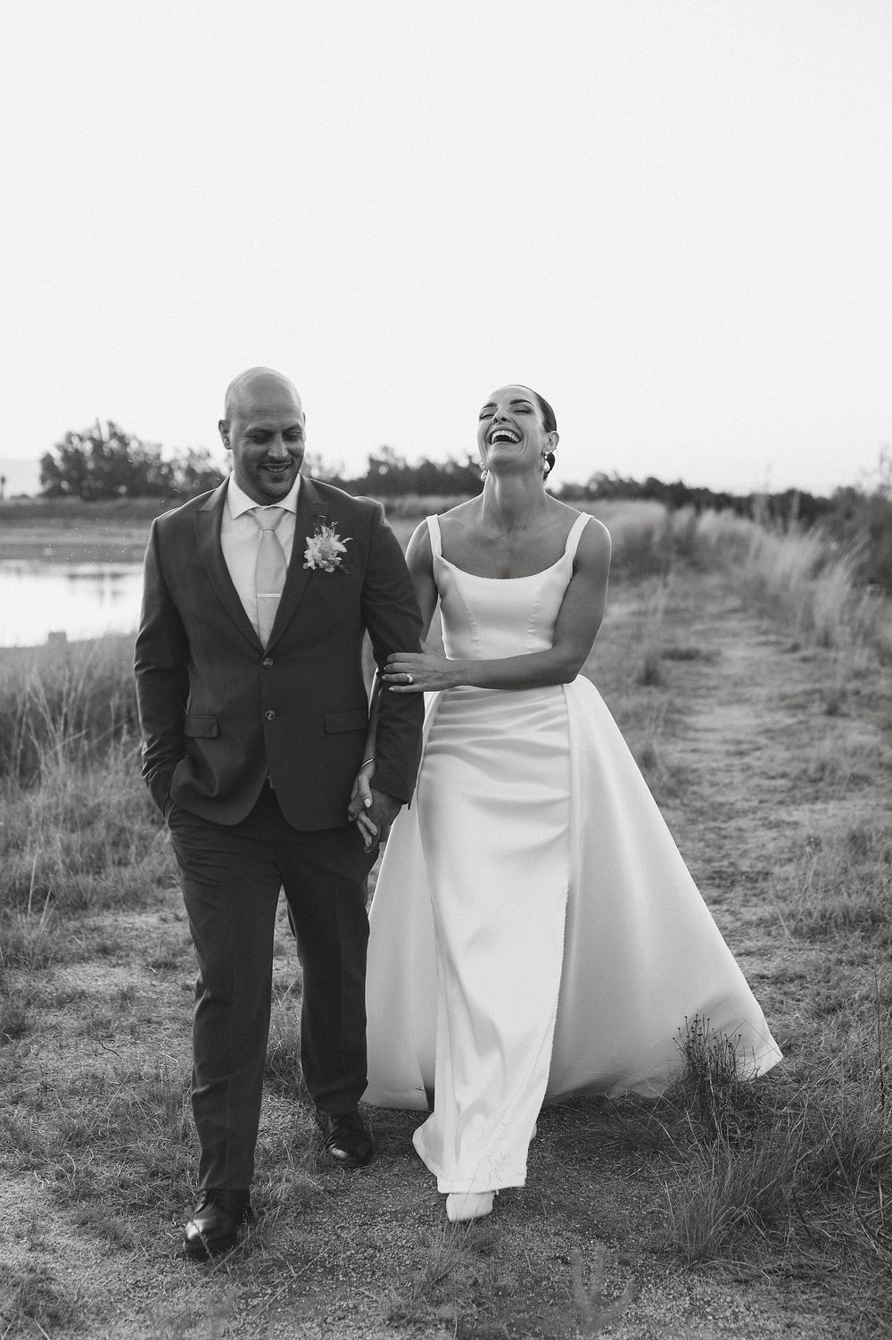 Romantic Cape Winelands sunset moment shared between bride and groom