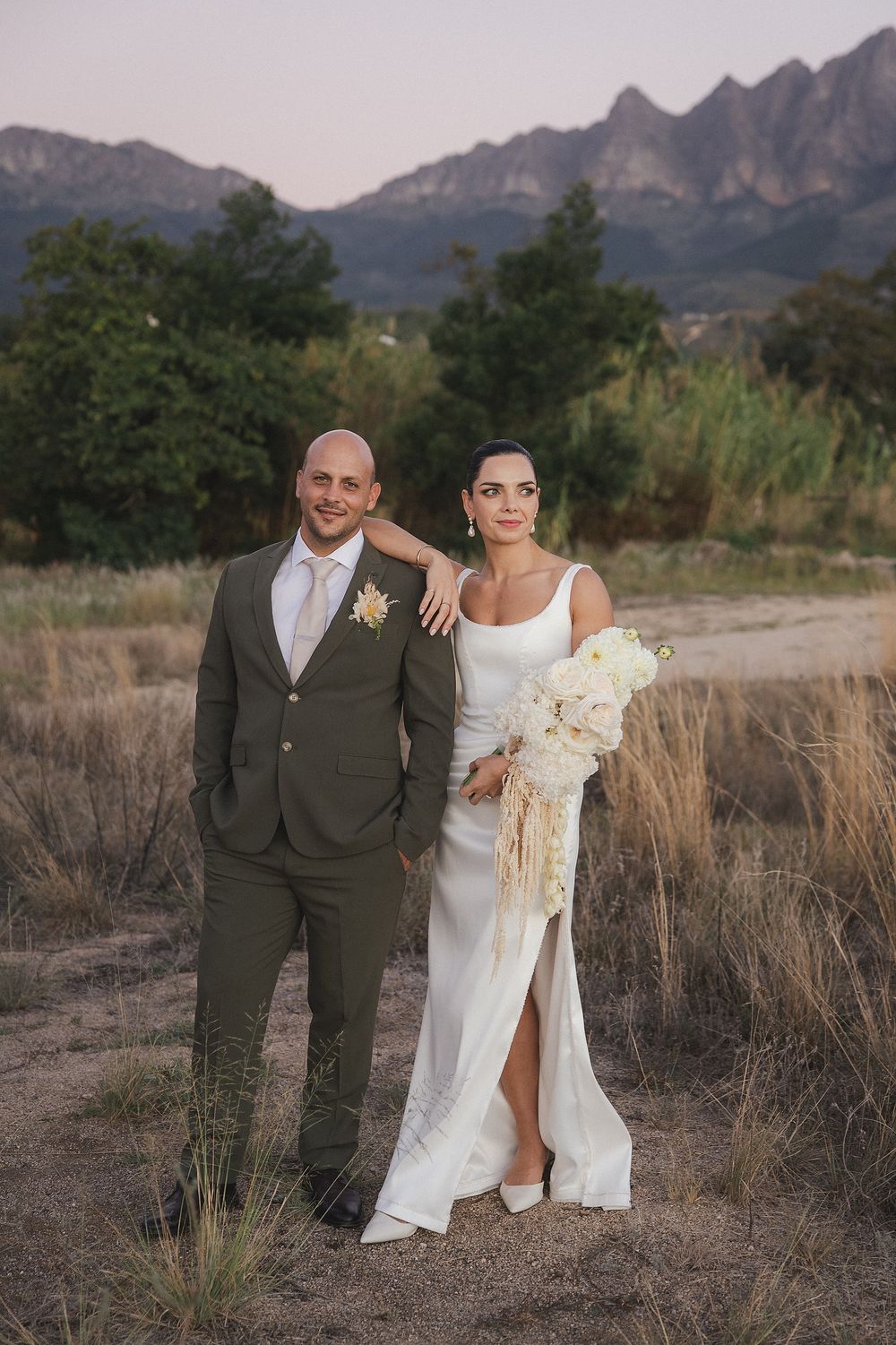 Romantic wedding portrait at Kleinevalleij with soft natural light and vineyard views