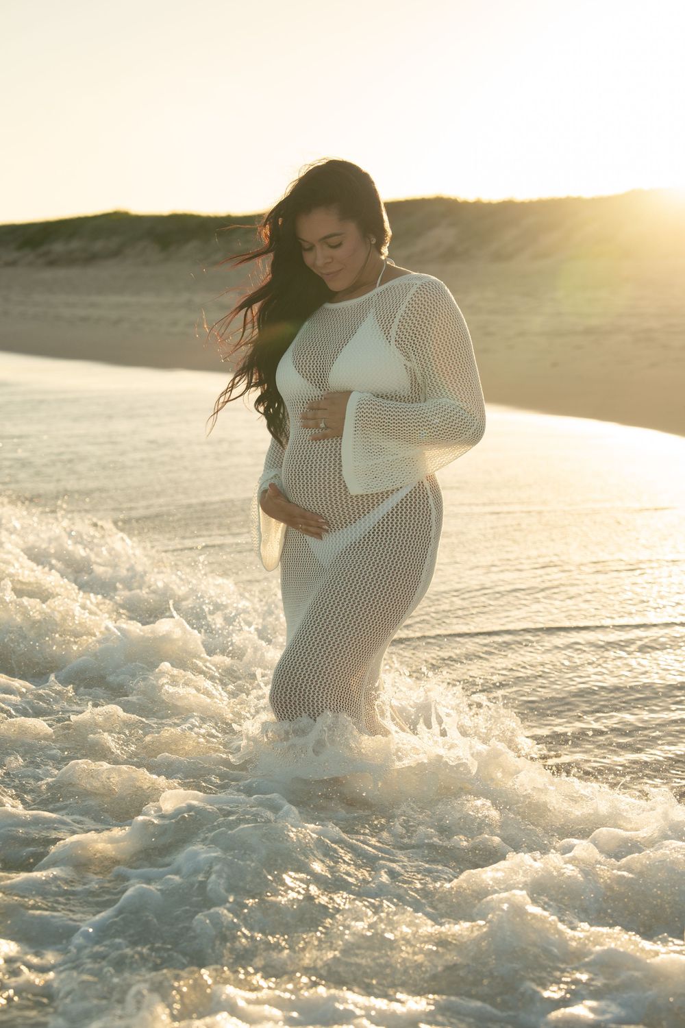 Wollongong beach maternity shoot with flowing dress and sunset light