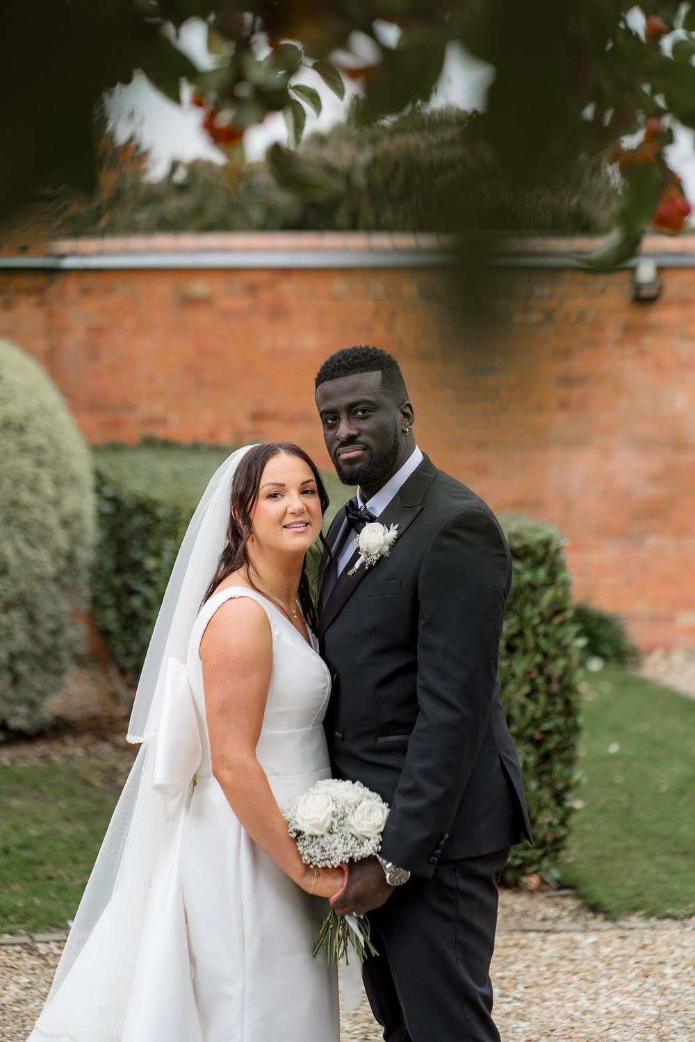 Lauren and Brima laughing wedding portraits Nottinghamshire