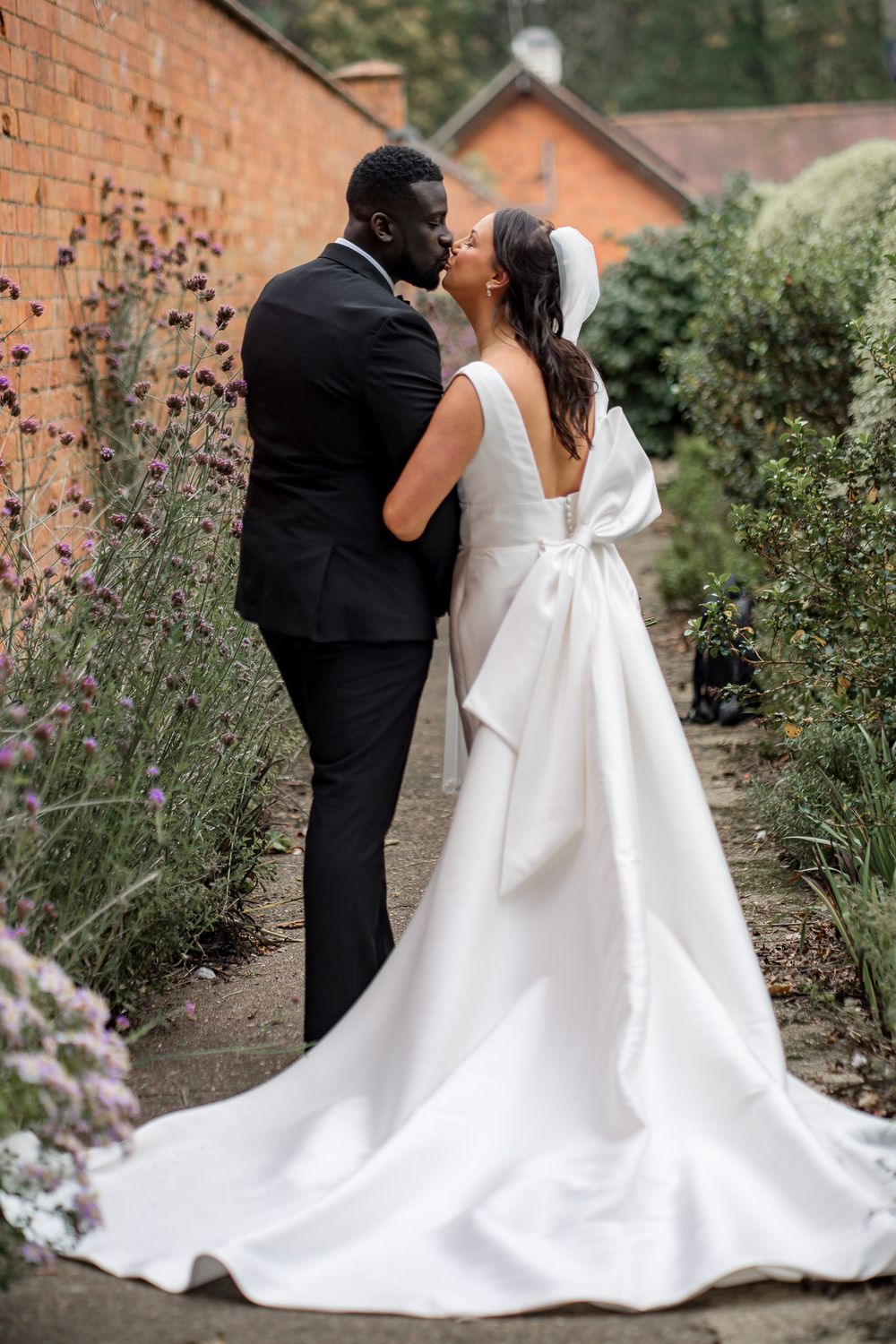 Bride and groom walking grounds Kelham House Country Manor