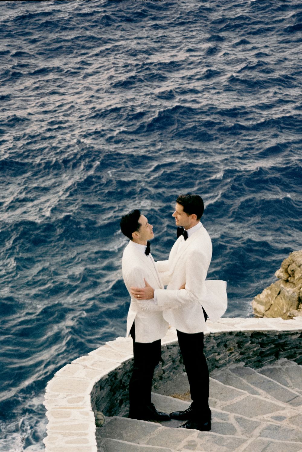 Same sex couple destination wedding LGBTQ+ photographer the deep blue Mediterranean Sea.