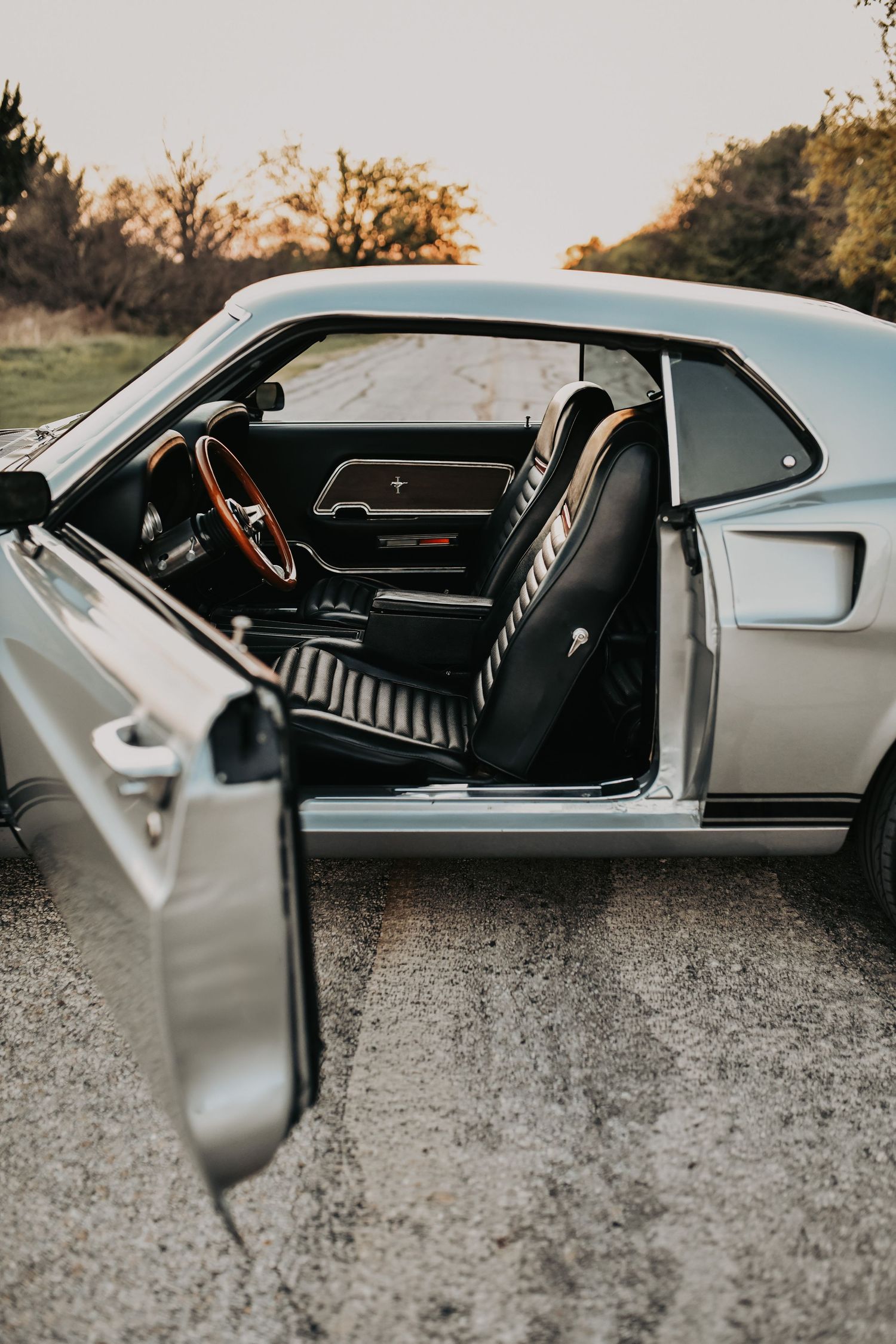 vintage Mustang engagement photos with stylish couple in McKinney Texas