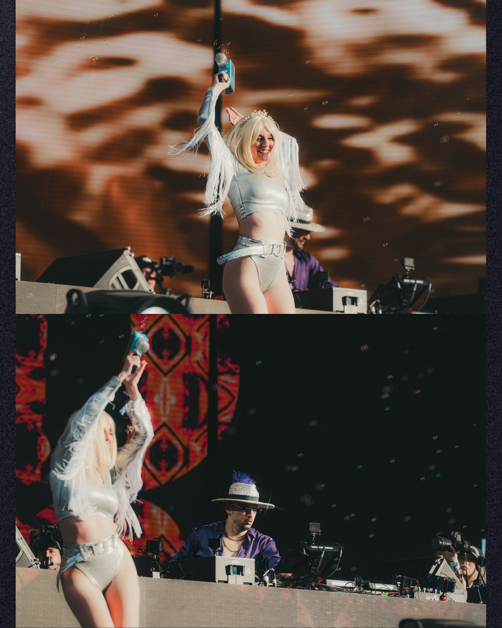Blonde female performer in white outfit dancing on stage at outdoor music festival with DJ equipment in background.