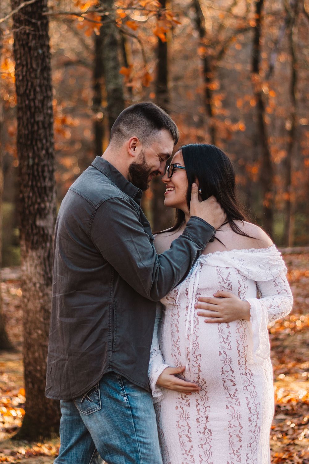 Maternity couple gazing at each other in outdoor scenery in lewis county Washington