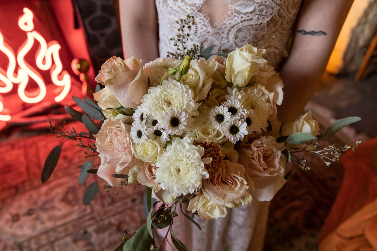 Photo of a bride holding her bouquet before walking down the aisle