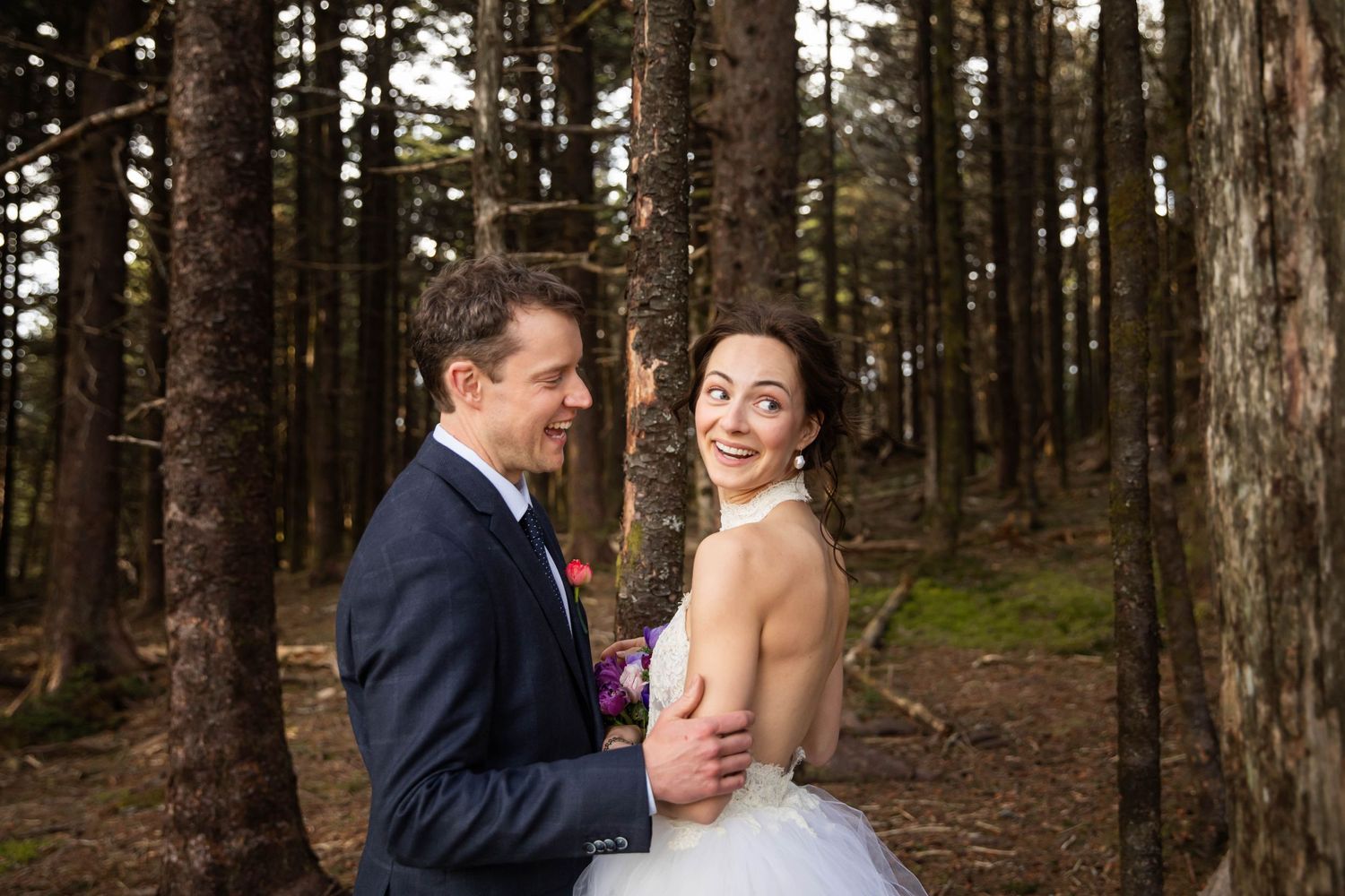 Photo of a bride and groom in the woods on Whitetop Mountain. Mountaintop elopement