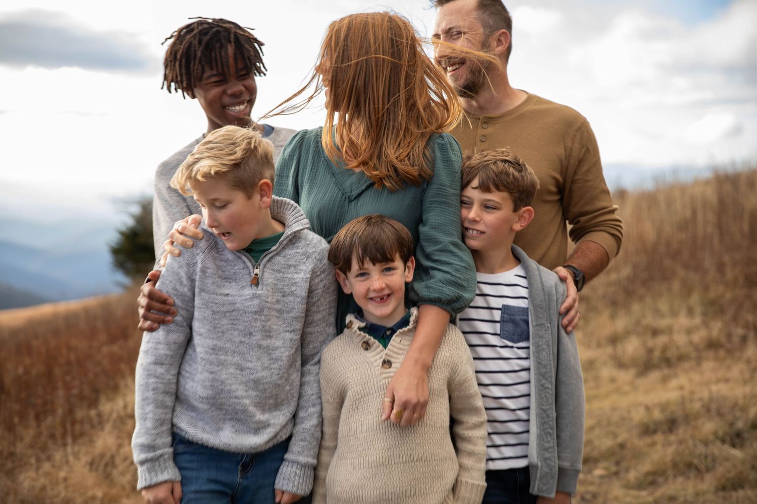 Photo of a family on Whitetop Mountain in southwest Virginia during a family photo shoot at sunset