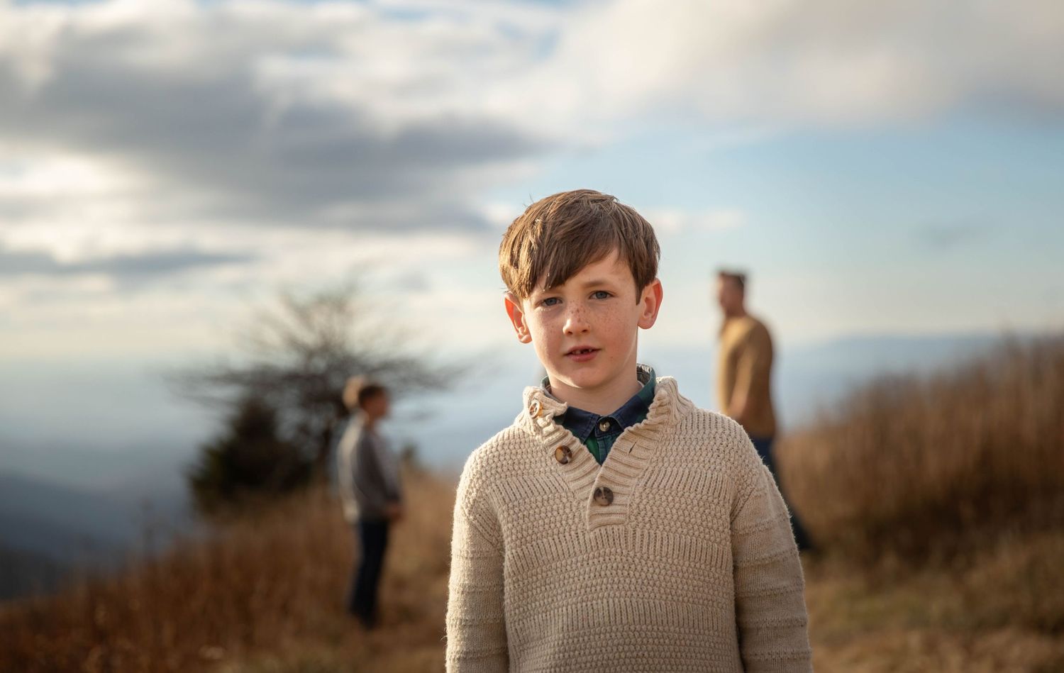 Photo of a family on Whitetop Mountain in southwest Virginia during a family photo shoot at sunset