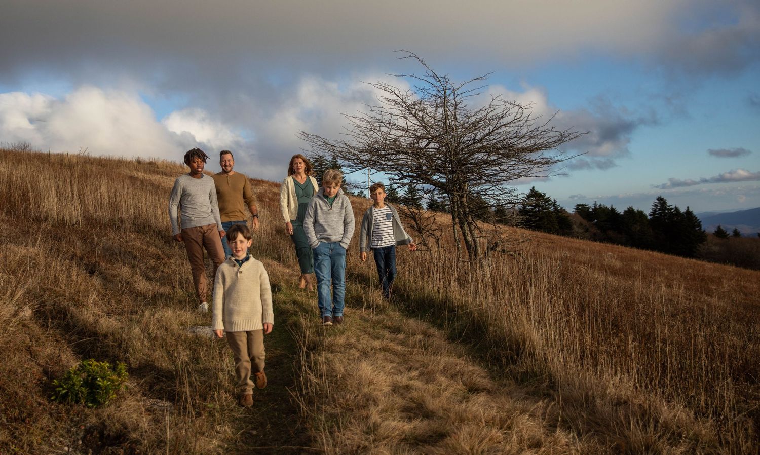 Photo of a family on Whitetop Mountain in southwest Virginia during a family photo shoot at sunset