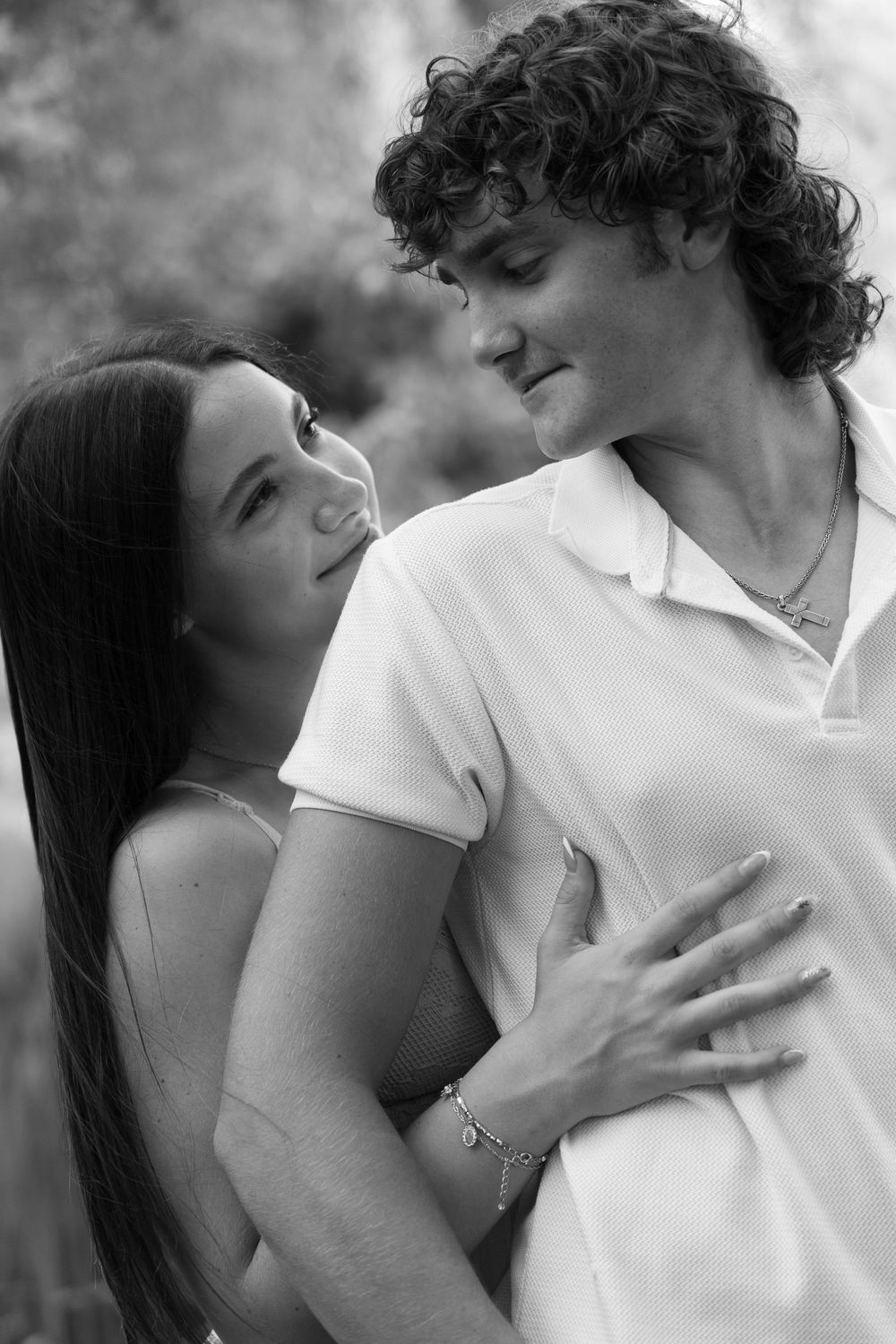 Black and white romantic portrait series showing intimate couple embraces and tender moments.