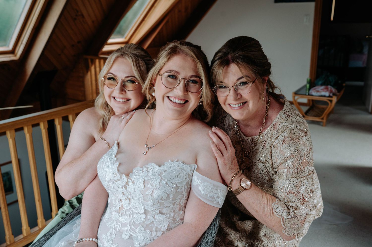 A heartwarming wedding day moment captured in a rustic attic setting.
