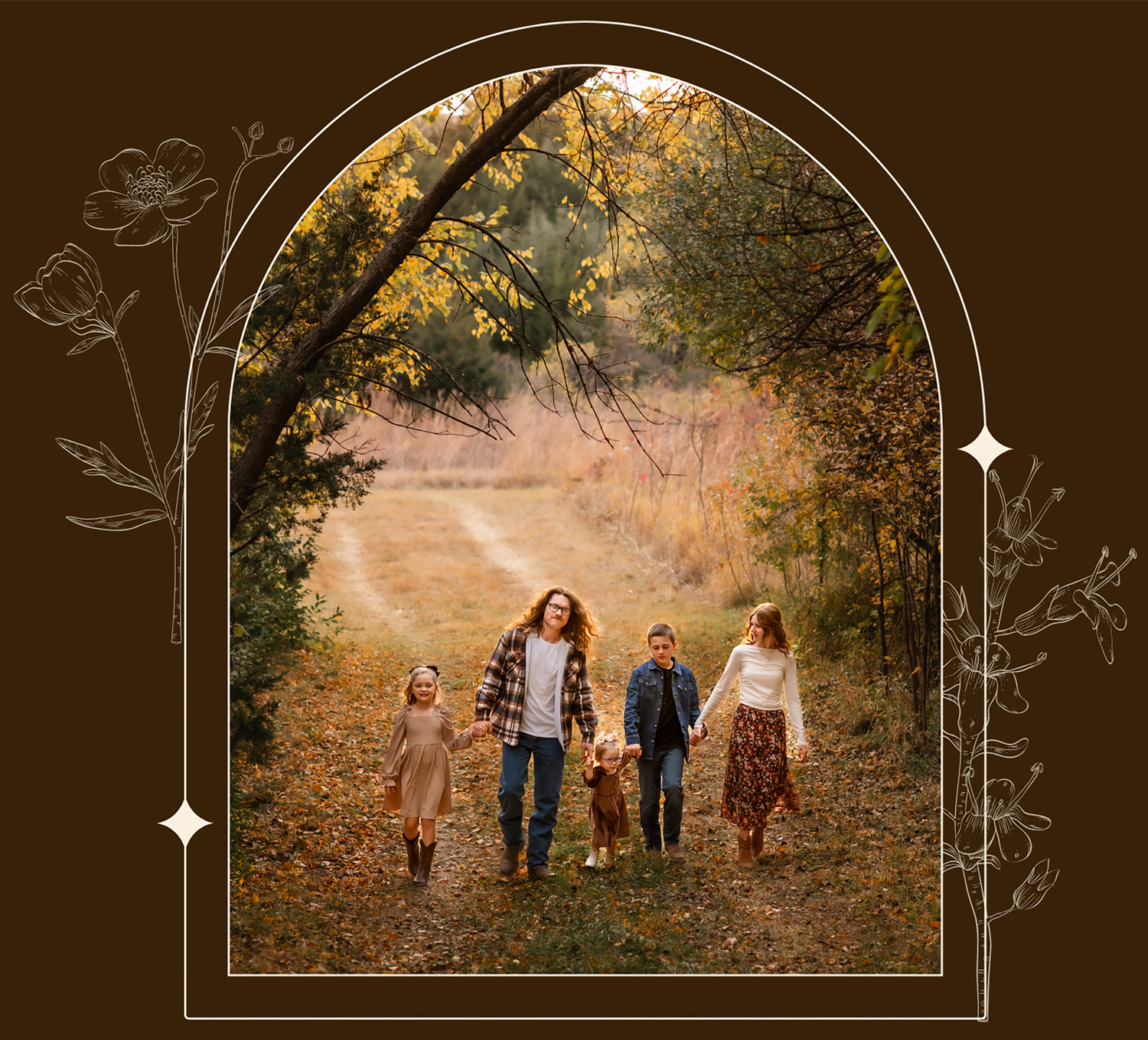 Family walking together on a winding autumn trail surrounded by golden leaves and trees.