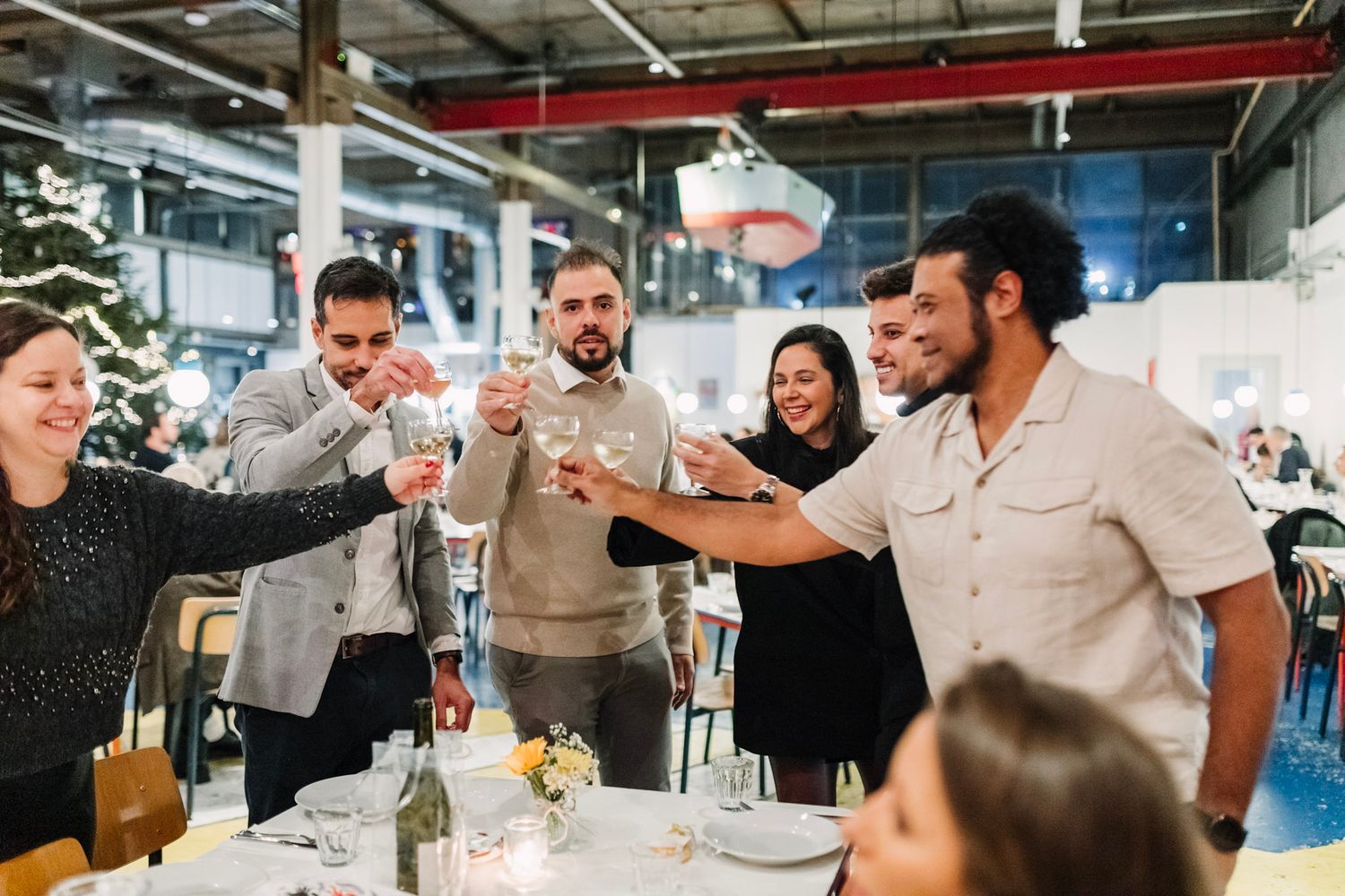 Groom toasting with friends during wedding dinner