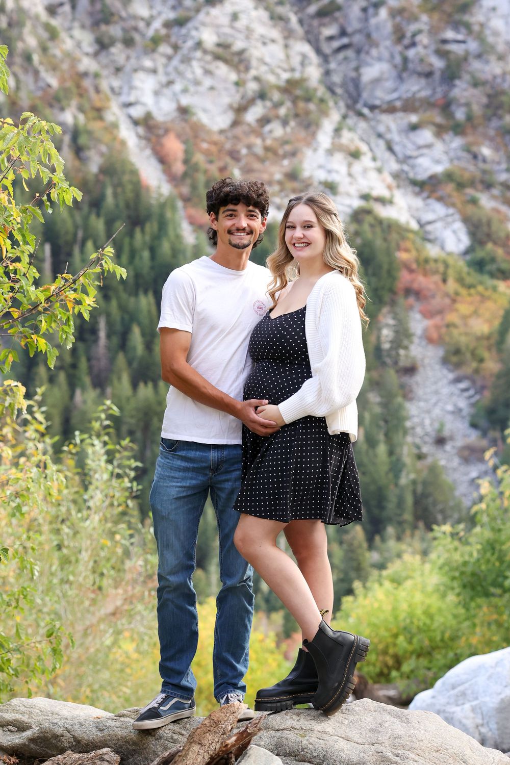 Couple embracing with canyon cliffs behind