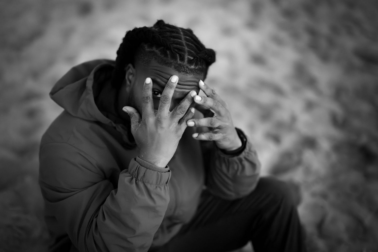 Black and white portrait series showing dramatic hand gestures covering the face.