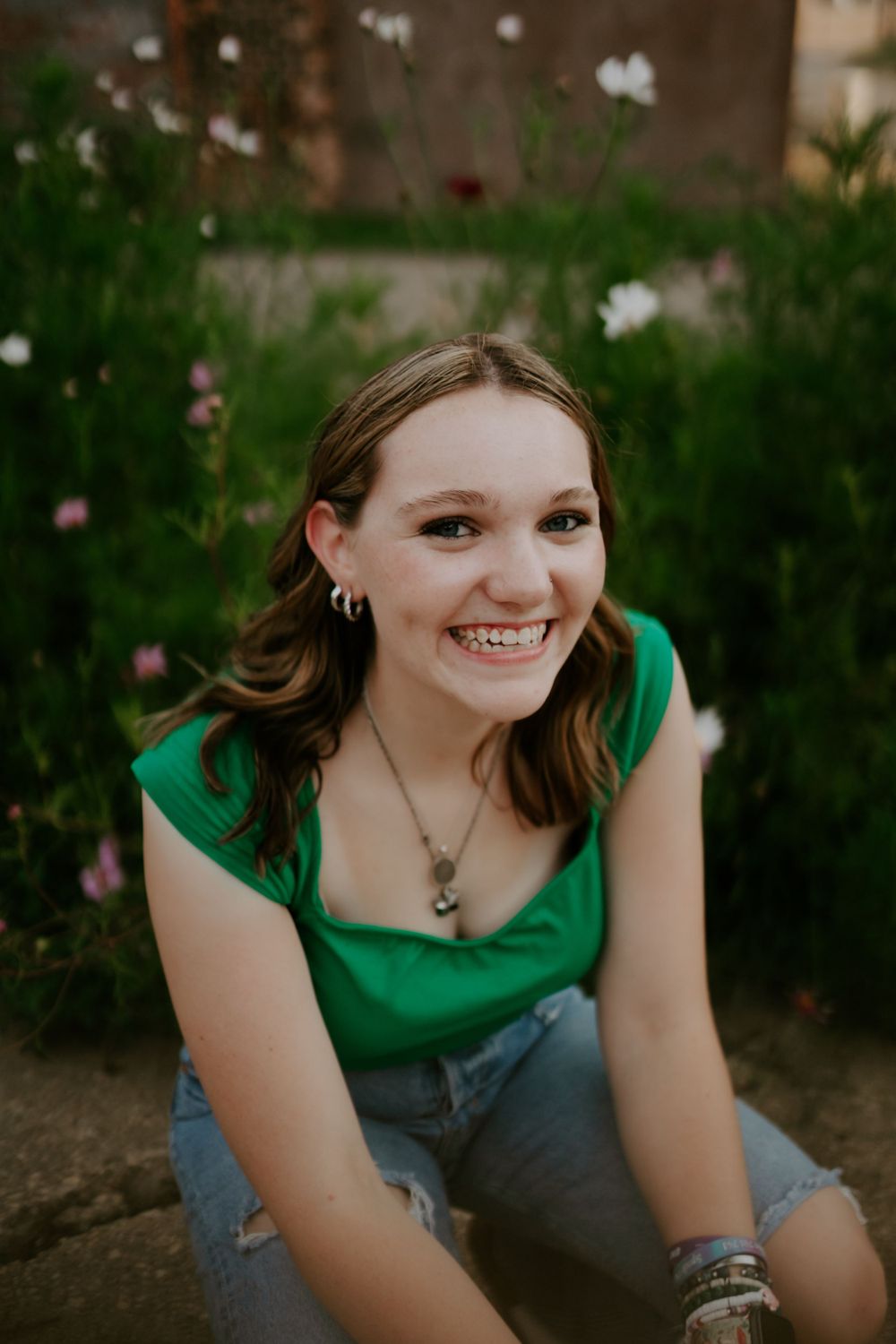 Close-up portrait sequence showing genuine smiles and a green sleeveless top.