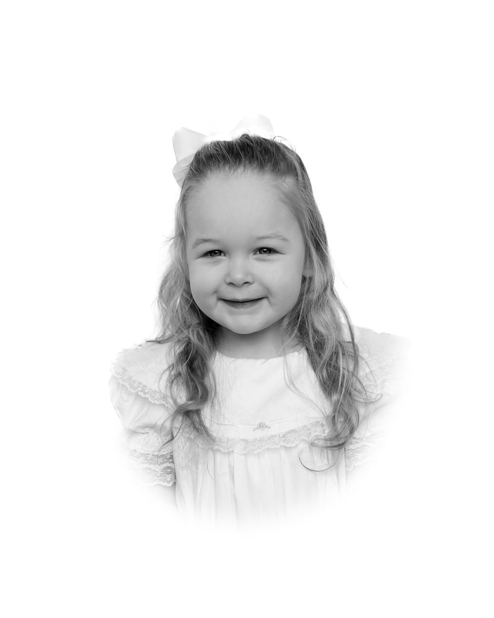 A series of black and white portraits showing a child's joyful expressions and smiles.