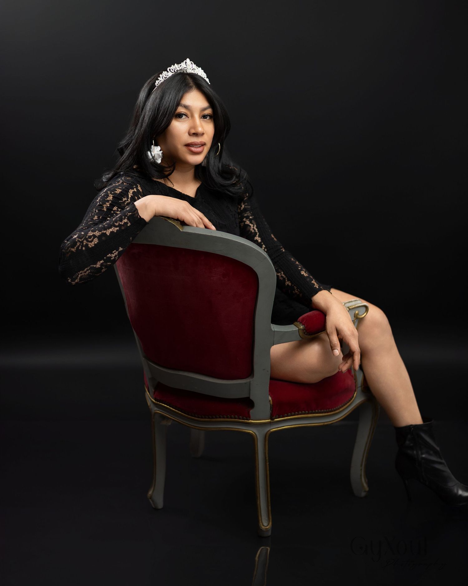 A dramatic studio portrait series showing a person in a burgundy velvet chair against a dark background.