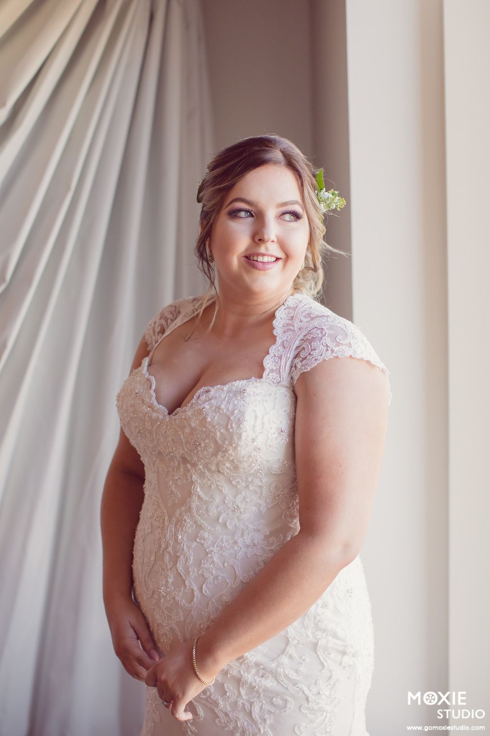 A series of bridal portraits showing a beautiful lace wedding dress against a light backdrop.