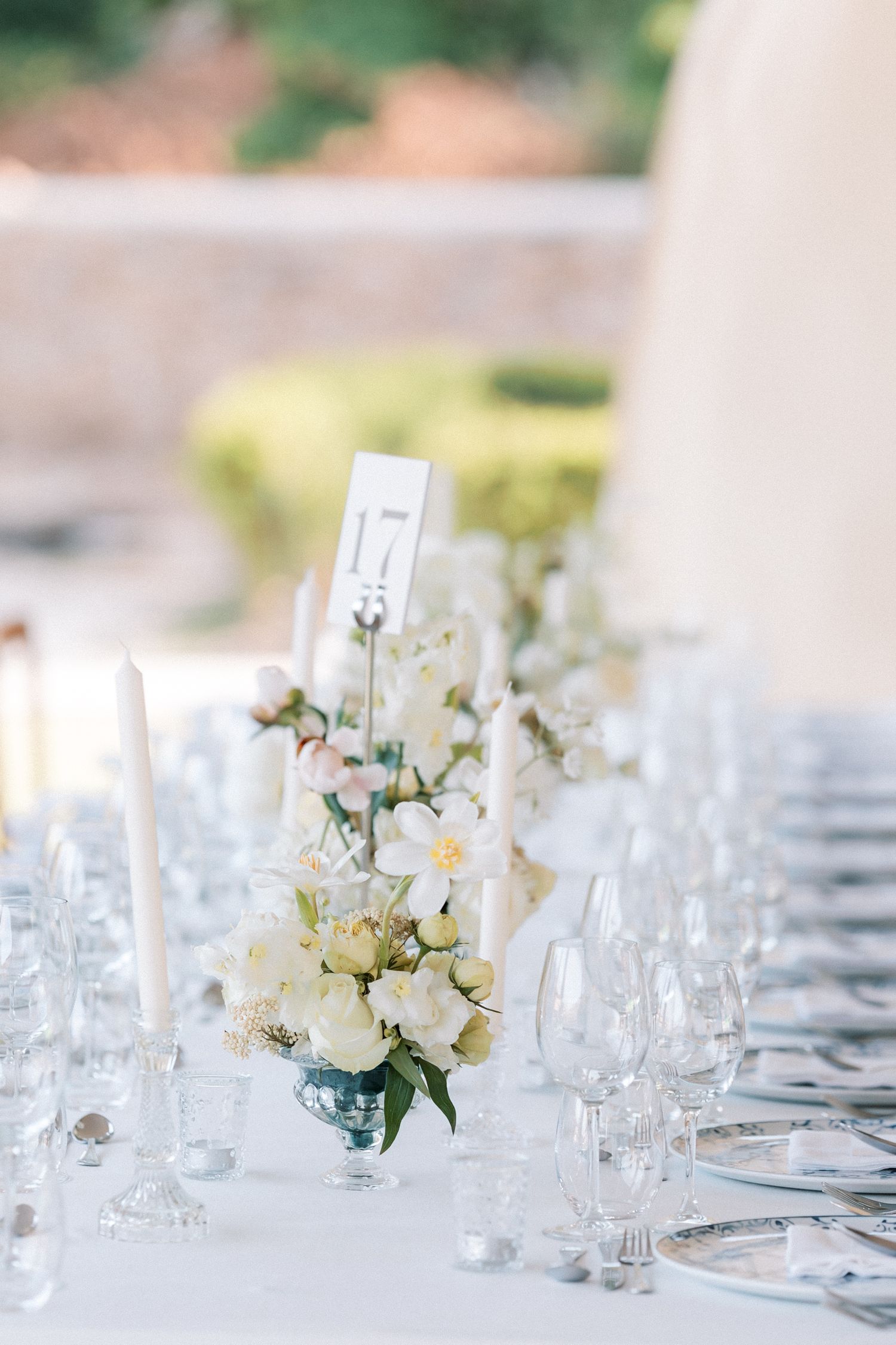 Romantic wedding dinner setup with white florals at Palácio do Correio-Mor