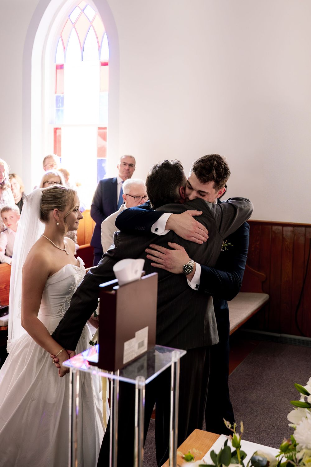 A series of intimate moments captured during a wedding ceremony in a bright church sanctuary.