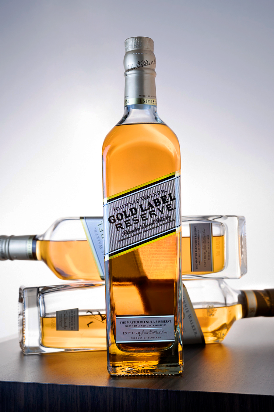 Commercial product photography featuring a bottle of alcohol with supporting bottles in the background, created by Chris Z of Zeng Studio.