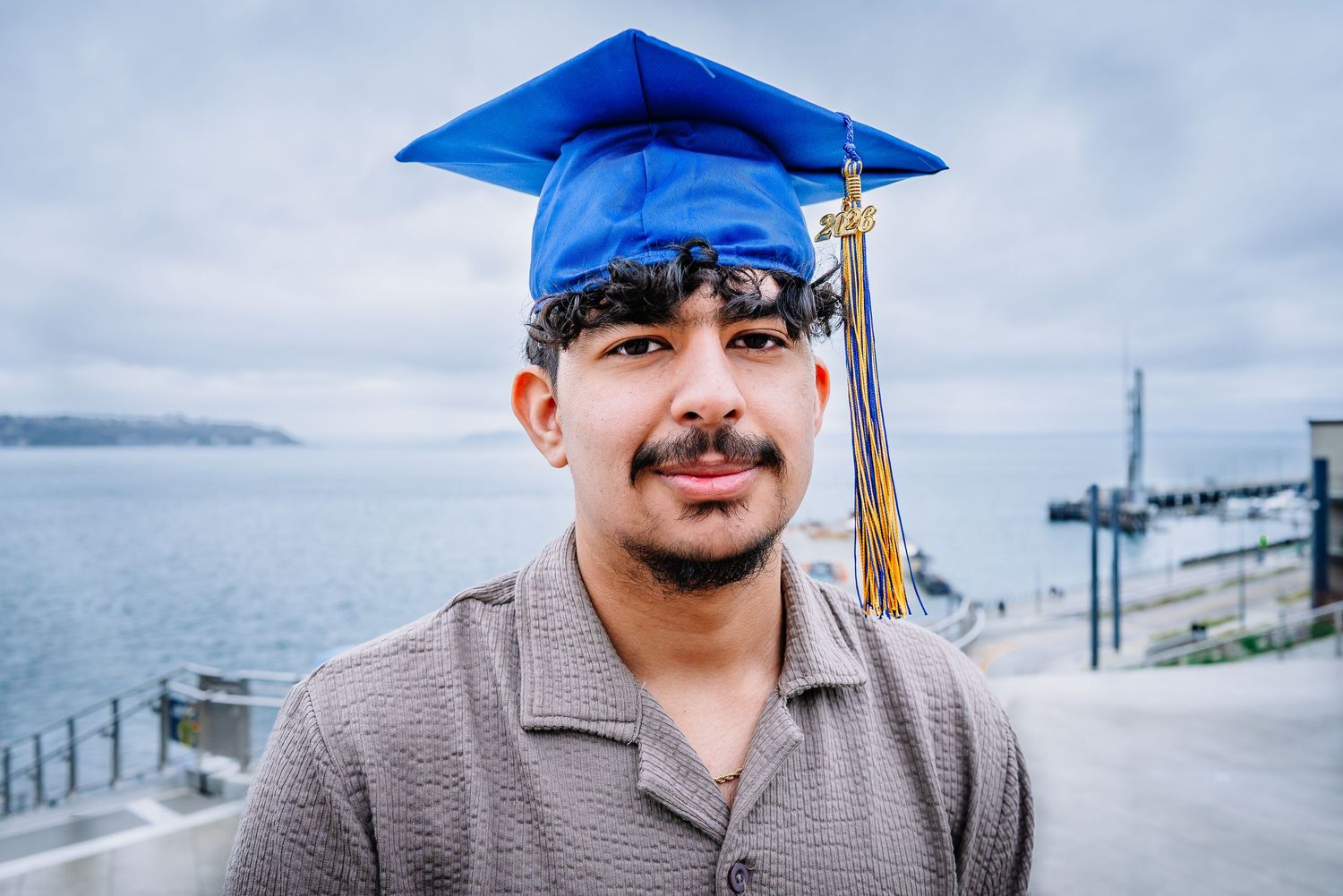Seattle graduation portrait with blue cap and tassel