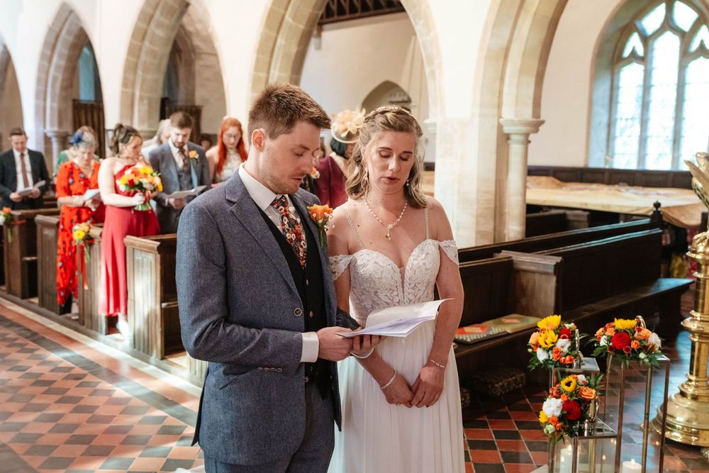 Elmore Court Wedding by Cotswolds Zara Davis Photography in Gloucestershire bride and groom at elmore church