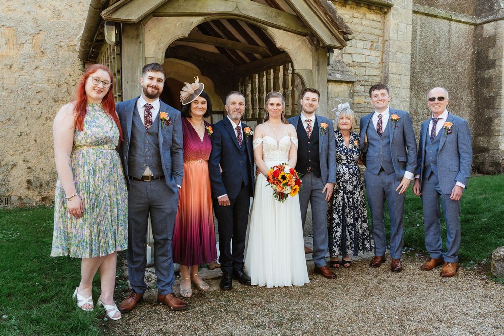 Elmore Court Wedding by Cotswolds Zara Davis Photography in Gloucestershire family photograph at the church in elmore