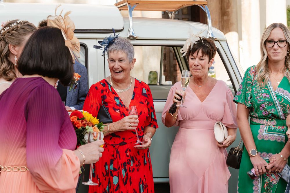 Elmore Court Wedding by Cotswolds Zara Davis Photography in Gloucestershire candid of guests in drinks reception