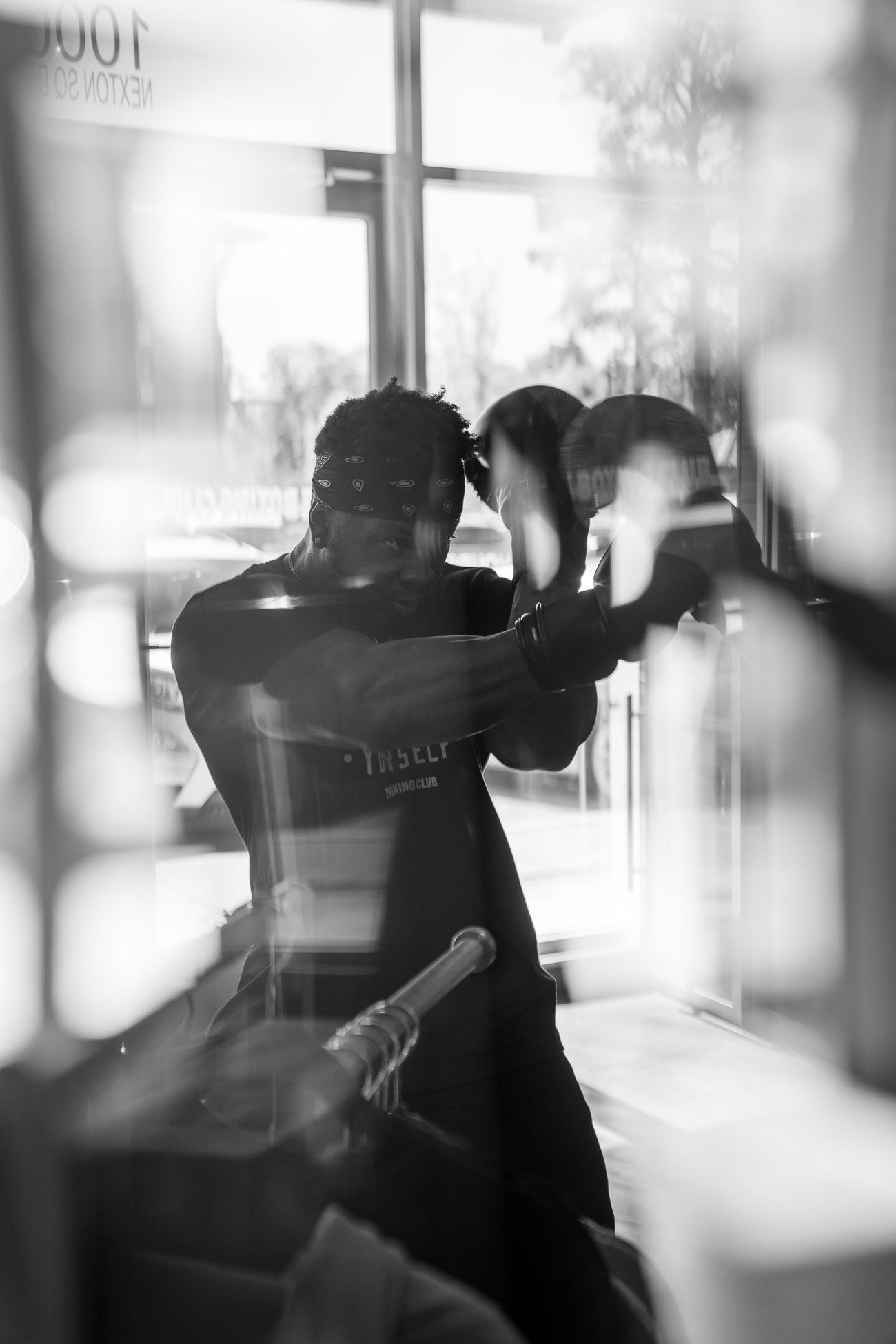 Male boxer training with gloves raised at Title Boxing Gym during a workout session in Summerville South Carolina