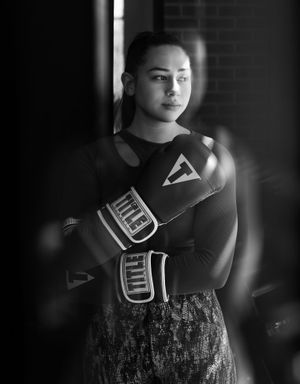 k and white athlete portrait with dramatic side lighting and shadow at Title Boxing Gym in Summerville South Carolina