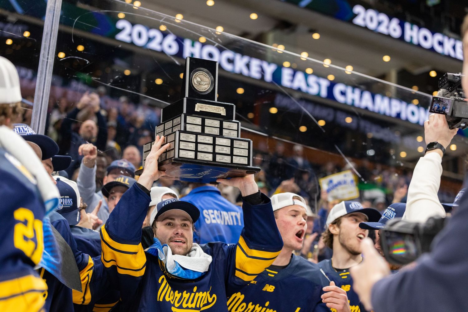 Fans celebrate enthusiastically at a hockey championship game.