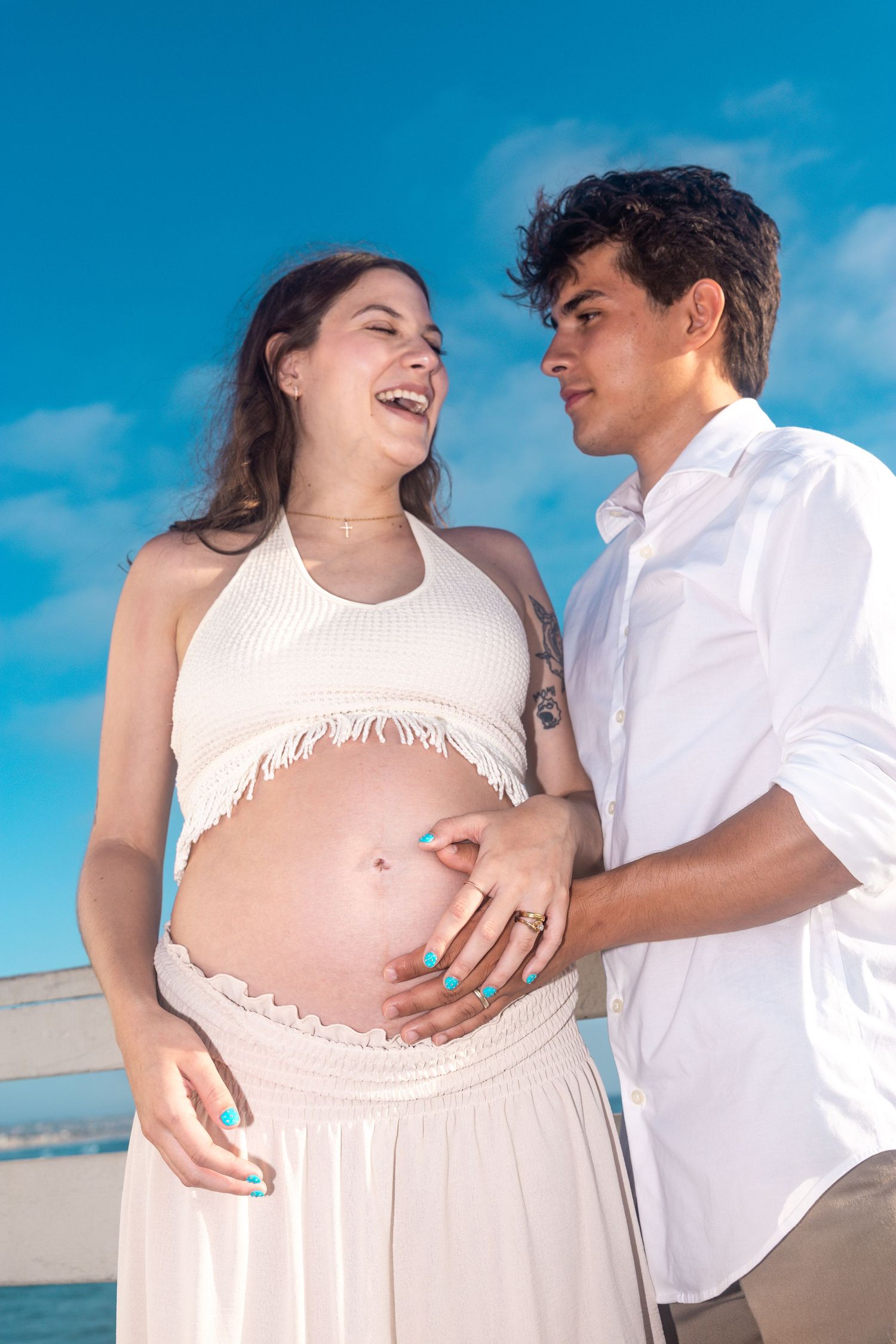maternity shoot, man kissing belly