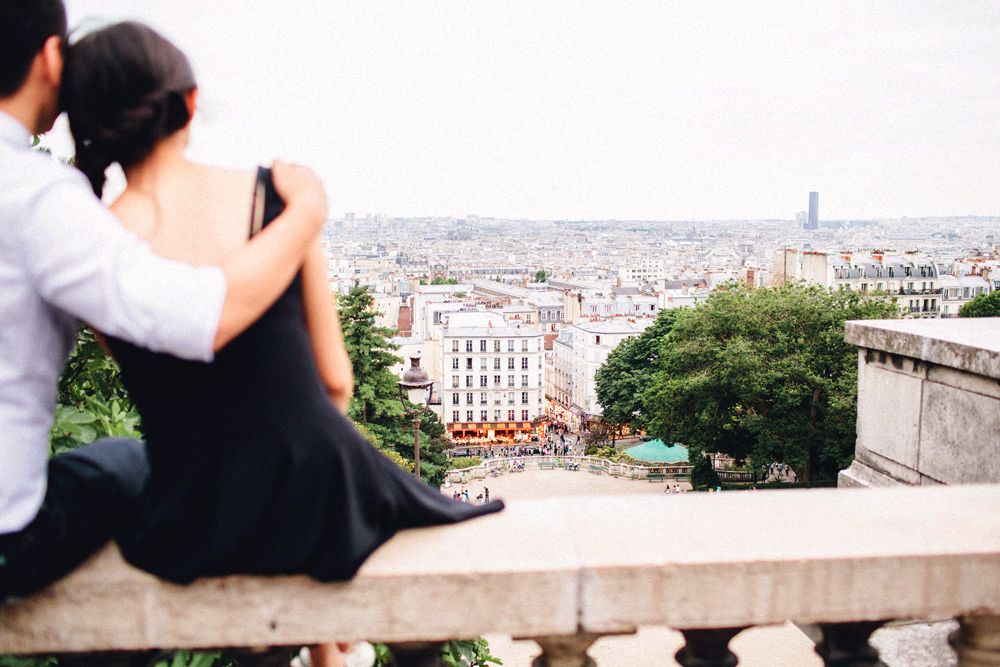 Couple overlooking Paris skyline from Montmartre – Paris wedding photographer