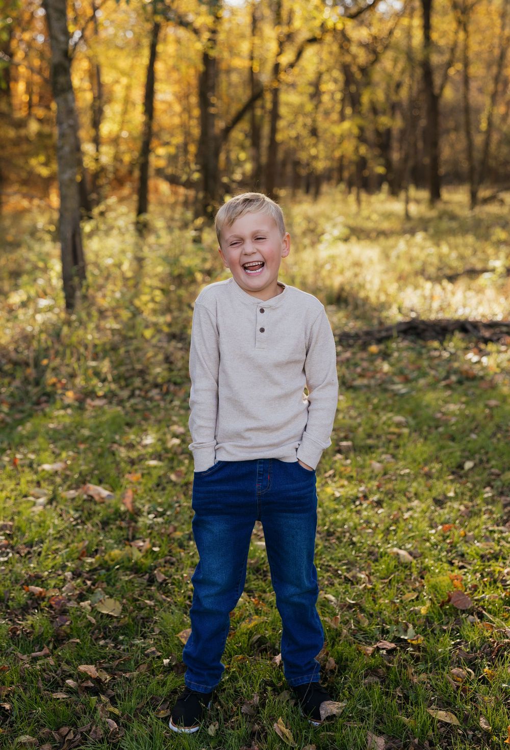A candid sequence of joyful moments captured in a fall forest setting.