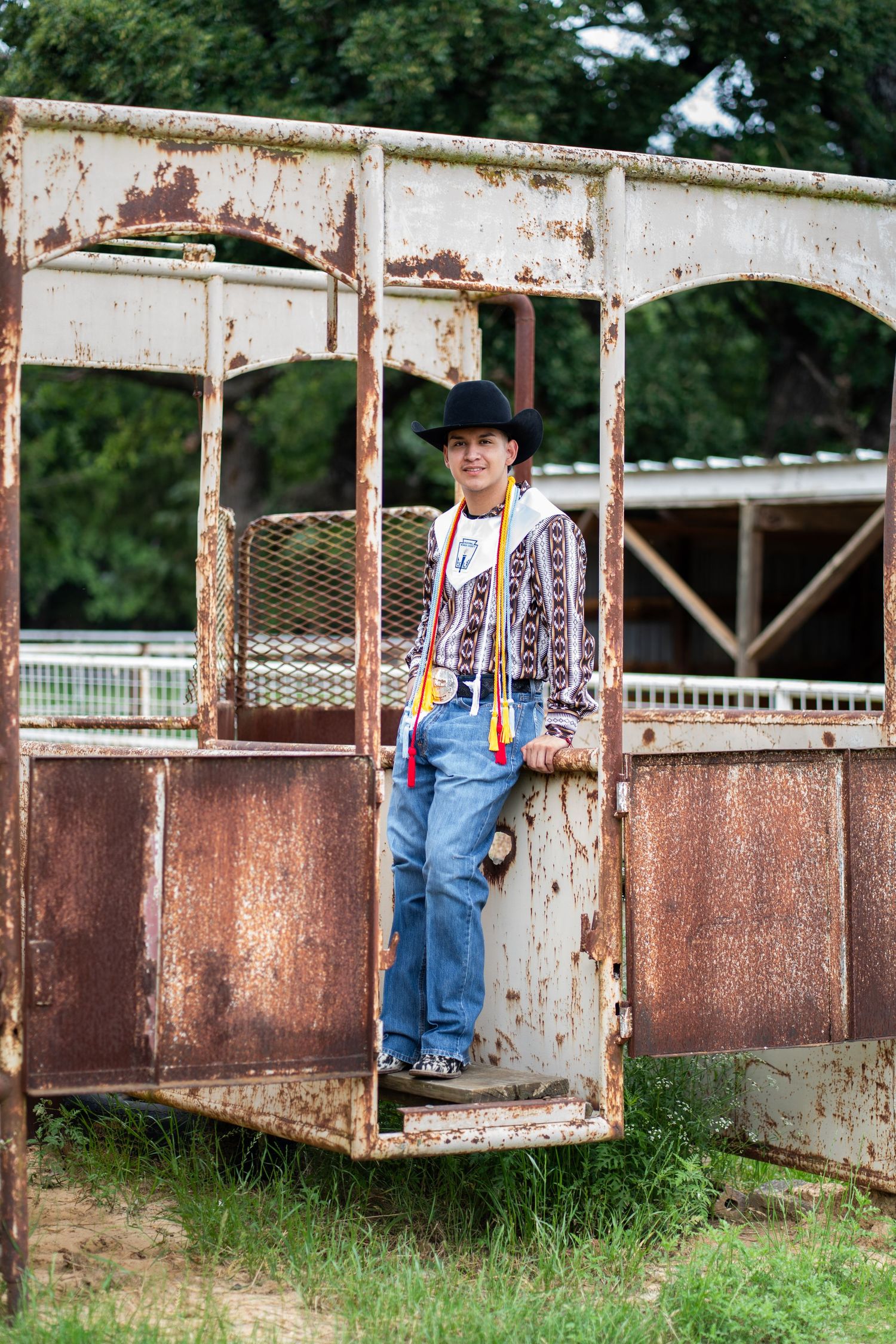 Rustic cattle loading chute provides unique backdrop for country-themed photos.