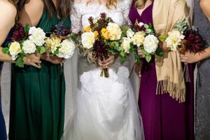 Bride-and-bridesmaids-holding-their-bouquets-in-Clare-Michigan.