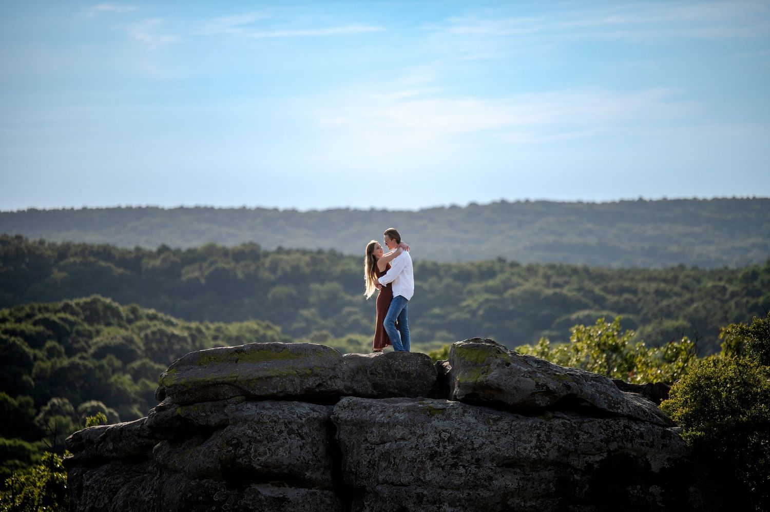Romantic hilltop portrait session with expansive valley views.