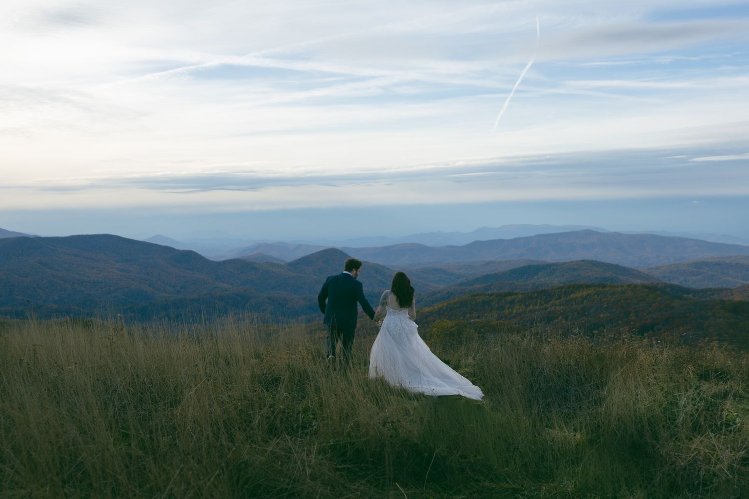 romantic couple holding hands at blue ridge mountain elopement near Asheville, North Carolina
